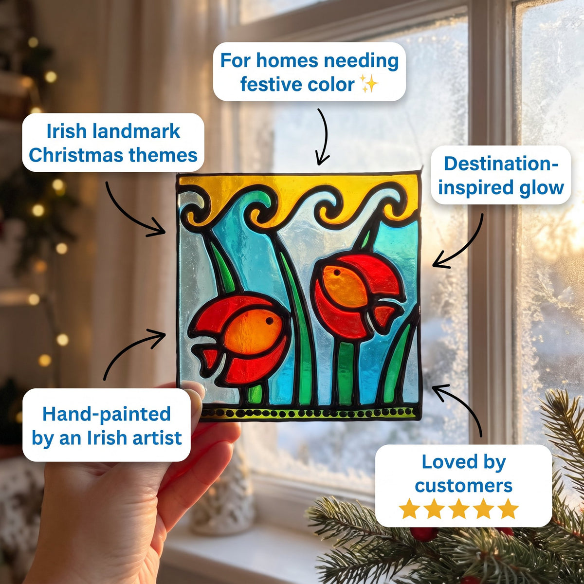 A hand holds a square stained-glass-style Christmas ornament or panel with two red fish and green plants, surrounded by promotional text callouts about Irish Christmas themes, festive color, and glowing design. The background shows a softly blurred window and holiday decor.
