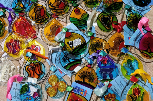 Colourful hand-painted glass suncatchers with Irish designs, ribbons and gift tags, handmade in Ireland by Honor Hales
